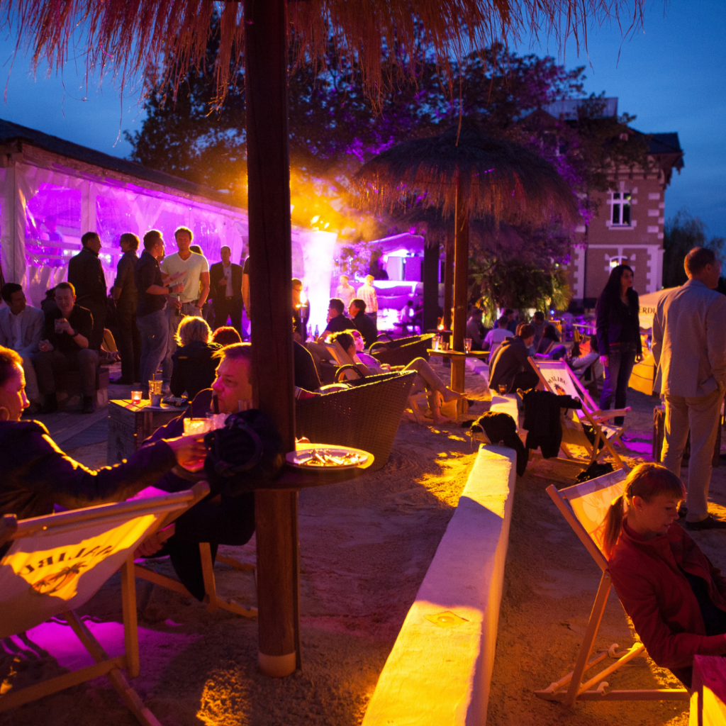 outdoor event lit up by purple lighting