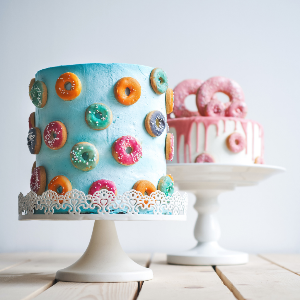 blue and white wedding cake with donut decorations