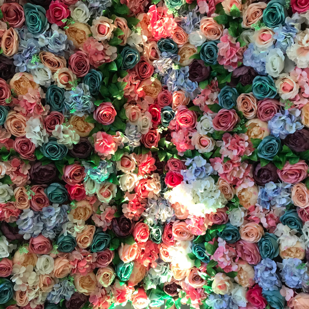 colourful flower wall arrangement with blue and pink flowers