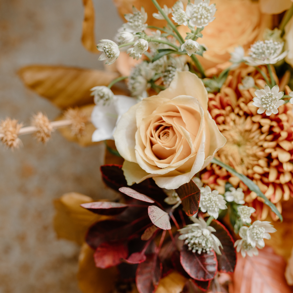 orange wedding flower arrangement