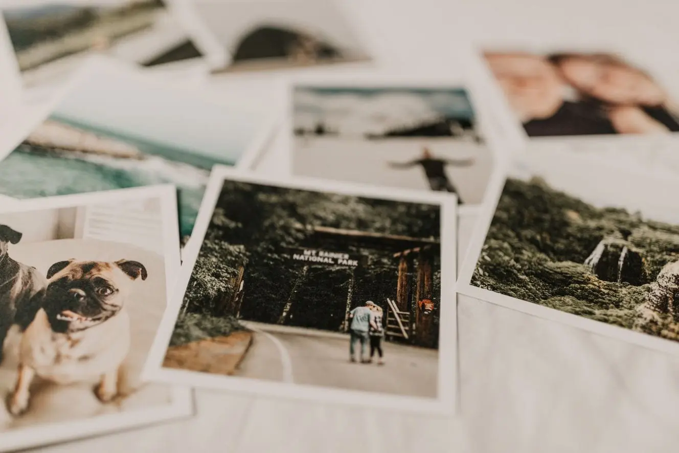 close up of Polaroid pictures laid on a bed