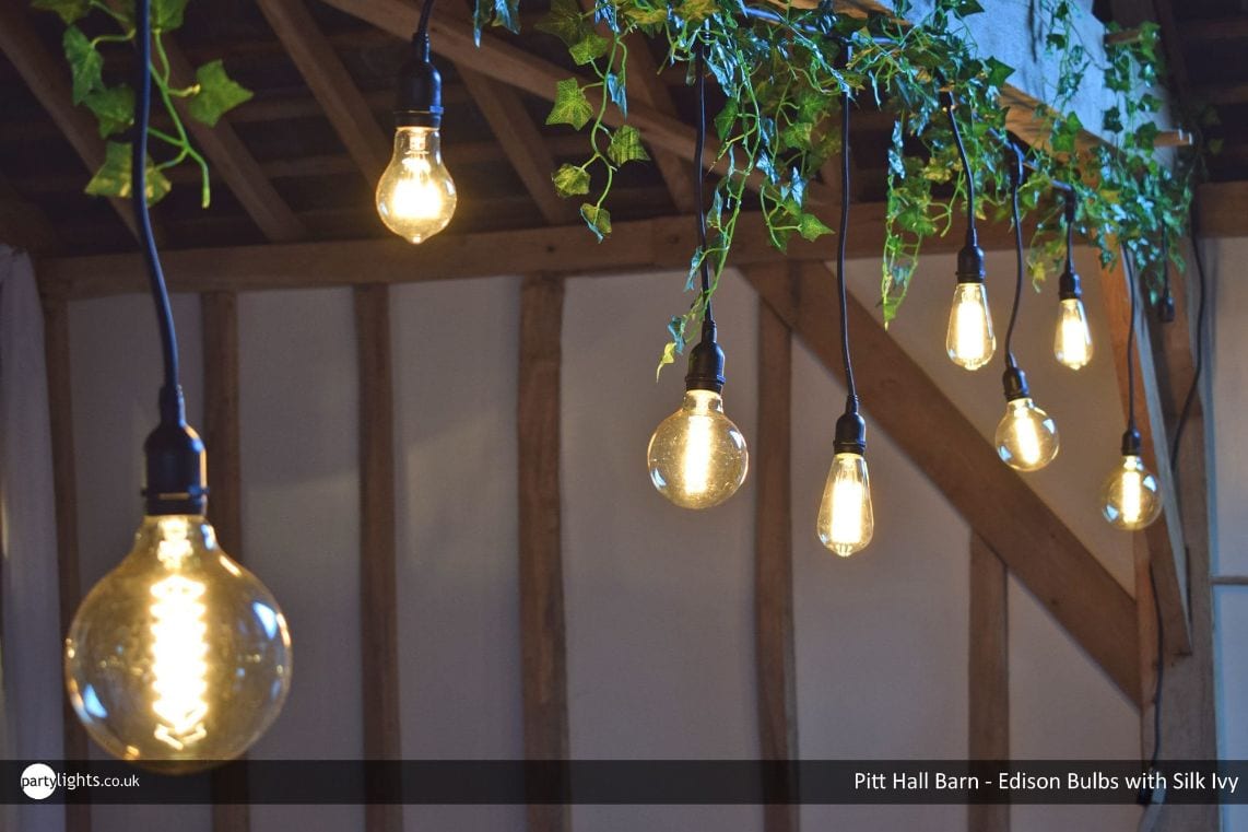 Light bulbs hanging from roof beams