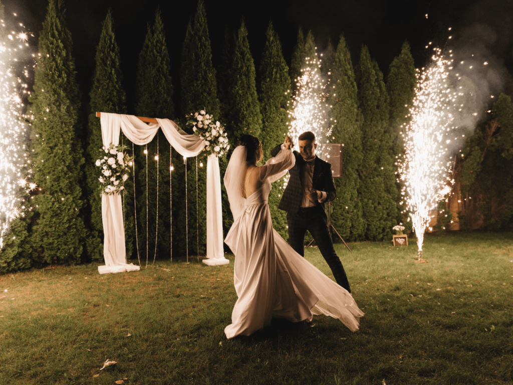 wedding couple dancing with sparkles in the background
