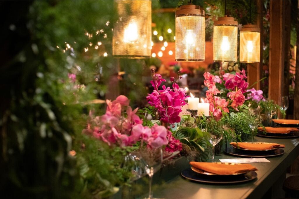 Wedding table dressed in an abundance of greenery and flowers. 